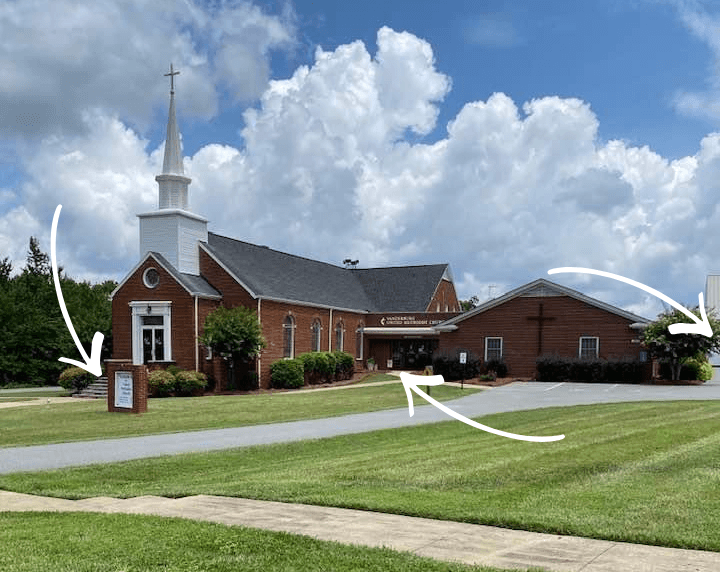 The Vanderburg Methodist Church building, with arrows marking the three entrances